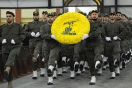 Hezbollah militants carry a flower wreath in the colors of the Shiite Muslim group's logo during a rally marking Hezbollah Martyrs' Day at the southern suburbs Beirut, Lebanon, 11 November 2011. According to local media, Hezbollah leader Hassan Nasrallah delivered a speech touching the issue of financing the Special Tribunal for Lebanon, the situation in Syria and the latest developments in the Middle East, especially the Iranian nuclear program and tension with the Western countries
