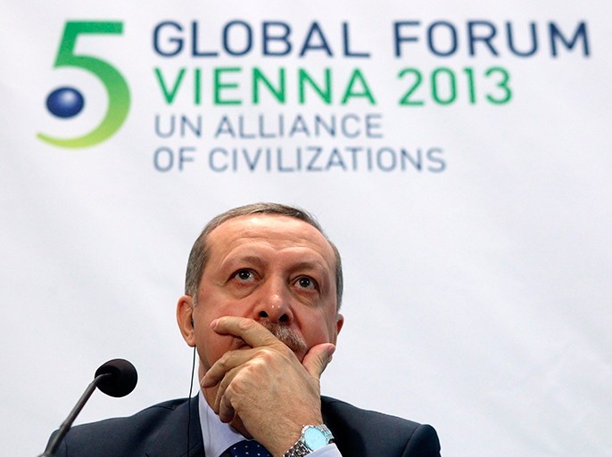 Turkey's Prime Minister Tayyip Erdogan listens during a news conference after the opening session of the fifth United Nations Alliance of Civilizations (UNAOC) Forum in Vienna February 27, 2013. REUTERS/Heinz-Peter Bader (AUSTRIA - Tags: POLITICS)