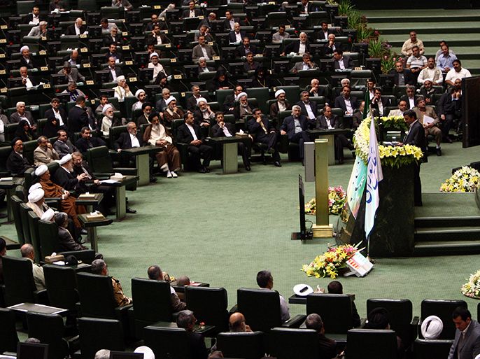epa03237756 Iranian president Mahmoud Ahmadinejad (on right) delivers his speech to the parliament in Tehran, Iran, 27 May 2012, during the inauguration ceremony of the new Iranian parliament which will for the next four years be dominated by conservatives. EPA/ABEDIN TAHERKENAREH