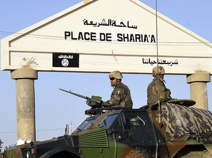 French troops patrol in Gao on February 14, 2013 . Schools reopened Monday in Gao in northern Mali after French and Malian troops moved in and armed Islamists who had held the town for seven months fled. AFP PHOTO / SIA KAMBOU