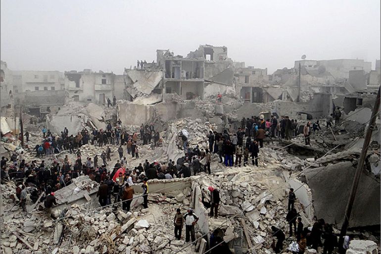 TOPSHOTS A handout picture released by Syria's opposition-run Aleppo Media Centre (AMC) shows Syrians inspecting destruction following an apparent surface-to-surface missile strike on the northern Syrian city of Aleppo on February 19, 2013. Six children were among at least 19 people killed in an apparent surface-to-surface missile strike on the northern Syrian city of Aleppo late on February 18, the Syrian Observatory for Human Rights said. AFP PHOTO/HO/SHAAM NEWS NETWORK