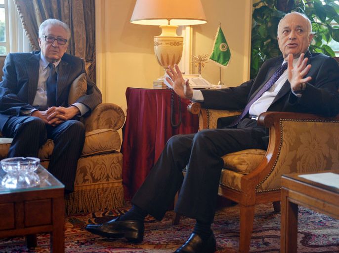 Arab League general secretary Nabil al-Arabi (R) gestures near Joint Special Representative of the United Nations and the League of Arab States on Syria Lakhdar Brahimi during a meeting on February 17, 2013