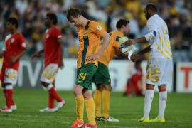 Australia's Brett Holman (C) reacts after a draw against Oman during their World Cup qualifier football match in Sydney on March 26, 2013. IMAGE STRICTLY RESTRICTED TO EDITORIAL USE - STRICTLY NO COMMERCIAL USE AFP PHOTO / Greg WOOD