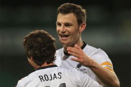 AUCKLAND, NEW ZEALAND - SEPTEMBER 11: Tommy Smith of New Zealand congratulates Marco Rojas on his goal during the FIFA World Cup Qualifier match between the New Zealand All Whites and Solomon Islands at Eden Park on September 11, 2012 in Auckland, New Zealand.