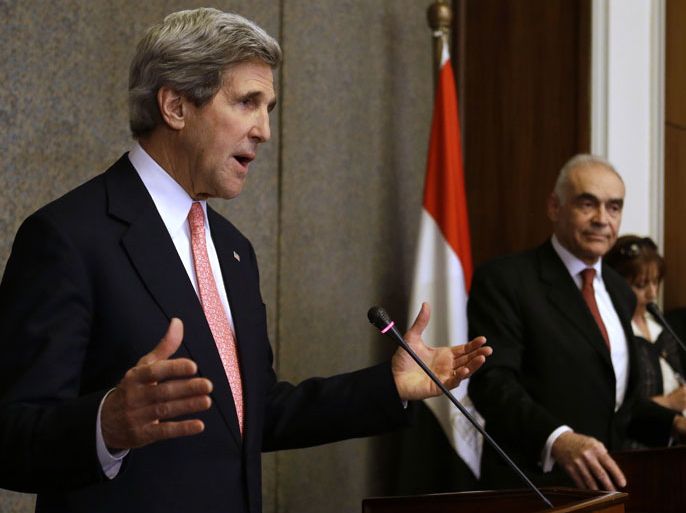 EGYPT : US Secretary of State John Kerry speaks during a joint news conference with Egyptian Foreign Minister Mohammed Kamel Amr (R) at the foreign ministry in Cairo on March 2, 2013. Kerry is in Cairo to push for a way out of Egypt's violence-wracked political impasse, underlining the need for a consensus to overcome a crippling economic crisis. AFP PHOTO/POOL/JACQUELYN MARTIN