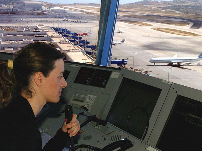epa000207563 An air-traffic controller is focused on work at the control tower of Athens' Eleftherios Venizelos International Airport, Tuesday, 08 June 2004. During a presentation of measures taken ahead of the Olympic Games in August, Athens airport authorities on Tuesday said that from August 12 to 14, as well as on August 30, they expect 60 airplane arrivals or departures per hour, compared with the current 40-42 arrivals or departures per hour. They said that a total of 20,600 airplanes were due to land at the Eleftherios Venizelos airport in August, compared with the current monthly average of 17,000. With respect to passenger movement, more than 2 million arrivals were anticipated in August against 1.5 million in August last year. EPA/STYLIANOS AXIOTIS