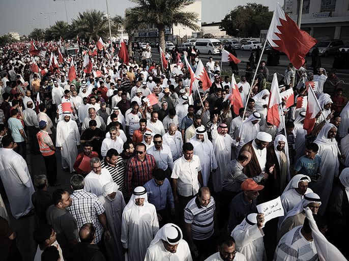 Bahraini protesters march during an anti-government demonstration in the village of Karranah, west of Manama, on March 1, 2013. Bahrain has witnessed two years of political upheaval linked to opposition demands for a real constitutional monarchy, with the unrest claiming at least 80 lives, according to international rights groups. AFP PHOTO/MOHAMMED AL-SHAIKH
