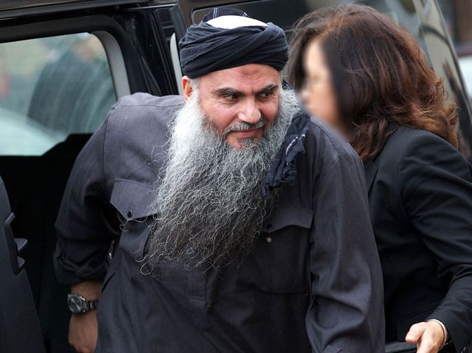 In this file picture taken on November 13, 2012 terror suspect Abu Qatada arrives at his home in northwest London , after he was released from prison. Radical cleric Abu Qatada, once dubbed Osama bin Laden's right-hand man in Europe, has been arrested in London for allegedly breaching his bail conditions, officials and media said on March 9, 2013.