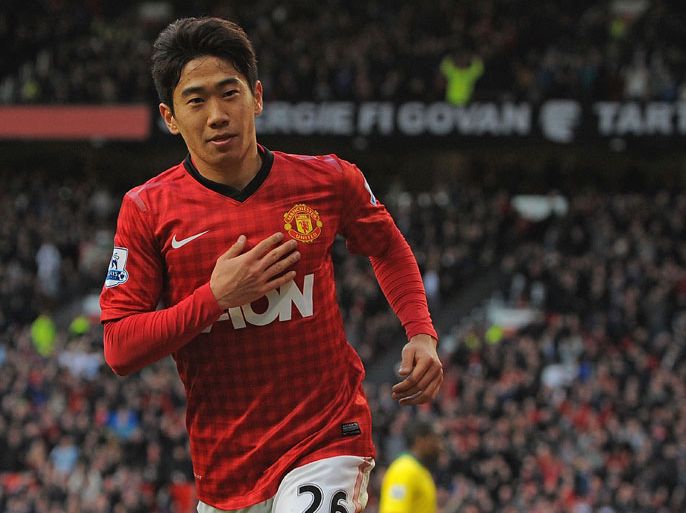 Manchester United's Japanese midfielder Shinji Kagawa celebrates after scoring his third goal of the English Premier League football match between Manchester United and Norwich City at Old Trafford stadium in Manchester, northwest England, on March 2, 2013. AFP PHOTO/ANDREW YATES