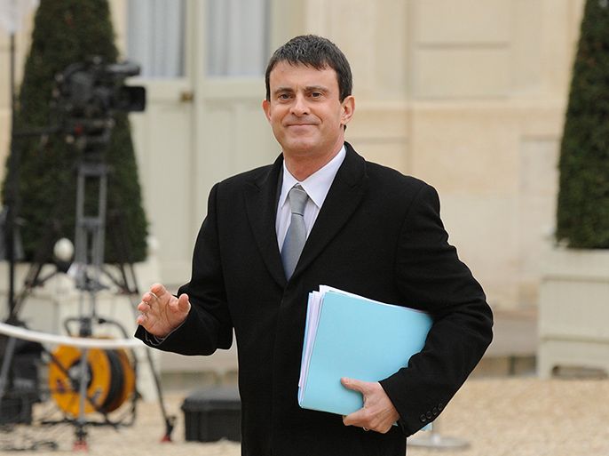 epa03533622 French Interior Minister Manuel Valls arrives at the Elysee Palace to attend a French Council on Defense following the situation in Mali with French President Francois Hollande (not pictured), in Paris, France, on 13 January 2013. Reports state that France is the first Western country to intervene to help Mali's government fighting the rebels who took control of the desert north nearly a year ago. France on 13 January 2013 said airstrikes against Islamist rebels in northern Mali were continuing, as Malian government forces backed by French warplanes fought the insurgents for a third day of a joint offensive. EPA/YOAN VALAT