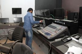 A Libyan man checks the site of a break-in at Alassema television station in Tripoli on March 7, 2013. Gunmen stormed the headquarters of a private Libyan television station and took away the channel's owner and four journalists, parliament's human rights commission said in a statement