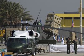 A battery of Iron Dome, short-range missile defence system, is seen behind a US Marine helicopter on the tarmac of Israel’s Ben Gurion airport ahead of the arrival of US President Barack Obama on March 20, 2013. Obama was on his way to Israel for the first time as US president, hoping to ease past tensions with his hosts and under pressure to narrow differences over handling Iran's nuclear threat. AFP PHOTO/MARCO LONGARI