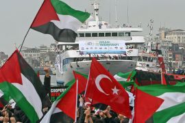 epa02507015 Thousands of Turkish protestors greets from harbour and boats the Mavi Marmara ship as it returns to Istanbul after Israel's deadly raid on an aid flotilla bound for Gaza Strip on 31 May, in Istanbul, Turkey on 26 December 2010. Israeli commandos on 31 May 2010 stormed six ships carrying hundreds of pro-Palestinian activists on an aid mission to the blockaded Gaza Strip, killing at least 10 people and wounding dozens after encountering unexpected resistance as the forces boarded the vessels. EPA/STRINGER TURKEY OUT