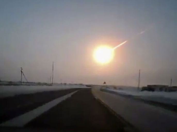 In this frame grab made from a video done with a dashboard camera, on a highway from Kostanai, Kazakhstan, to Chelyabinsk region, Russia, provided by Nasha Gazeta newspaper, on Friday, Feb. 15, 2013 a meteorite contrail is seen. A meteor streaked across the sky of Russia s Ural Mountains on Friday morning, causing sharp explosions and reportedly injuring around 100 people, including many hurt by broken glass.