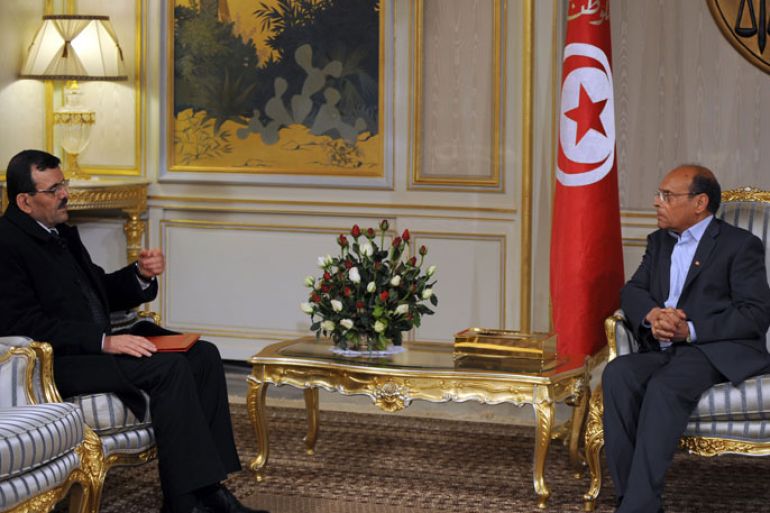 Tunisian President Moncef Marzouki (R) meets Prime Minister-designate Ali Larayedh following his meeting with leaders of local political parties on March 7, 2013 in Tunis. A deal on the composition of Tunisia's new government has been reached and will be presented on March 8, prime minister-designate Ali Larayedh said on March 7. AFP PHOTO / FETHI BELAID