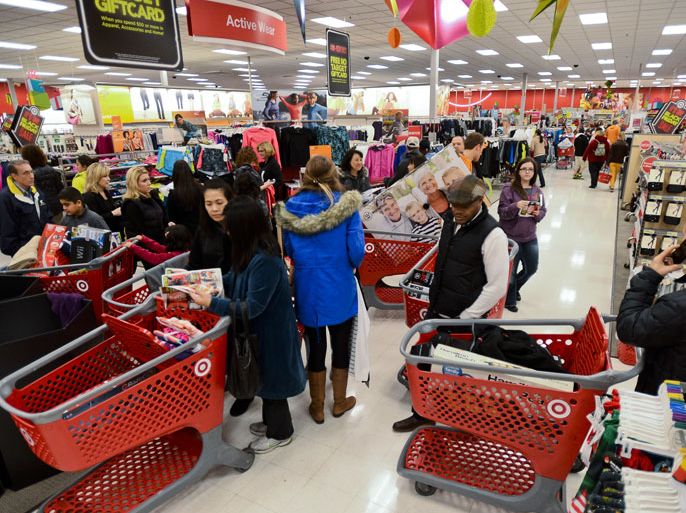 epa03483004 Shoppers at a Target store get a jump on holiday shopping and take advantage of Black Friday specials in Glenview, Illinois, USA, 22 November 2012. Many stores opened before the traditional midnight in an effort to increase sales. Black Friday gets its name because it is supposed to be the day business actually turn a profit for the year. EPA/TANNEN MAURY