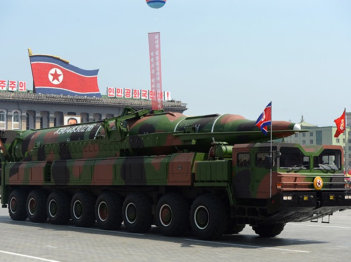 (FILES) This file photo taken on April 15, 2012 shows a military vehicle carrying what is believed to be a Taepodong-class missile Intermediary Range Ballistic Missile (IRBM), about 20 meters long, during a military parade to mark the 100 birth of the country's founder Kim Il-Sung in Pyongyang. North Korea threatened to carry out a "pre-emptive" nuclear strike on March 7, 2013 as the UN Security Council prepared to vote on new sanctions against the isolated state. AFP PHOTO / FILES / PEDRO UGARTE