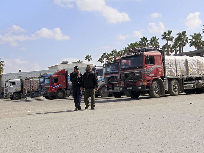 Trucks carrying supplies cross into Rafah town wait after crossing through the Kerem Shalom crossing between Israel and the southern Gaza Strip on March 5, 2013. Israel reopened the Kerem Shalom commercial crossing into southern Gaza, six days after closing it after a rocket fired from the Palestinian enclave hit the Jewish state. AFP PHOTO/SAID KHATIB