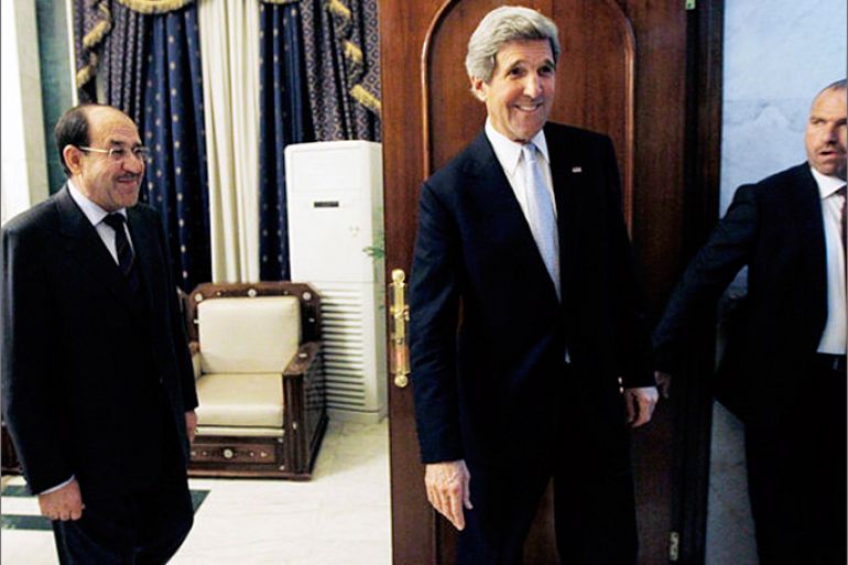 U.S. Secretary of State John Kerry after meeting with Iraqi Prime Minister Nouri Maliki, left, in Baghdad on Sunday. (Jason Reed / Associated Press / March 24, 2013)