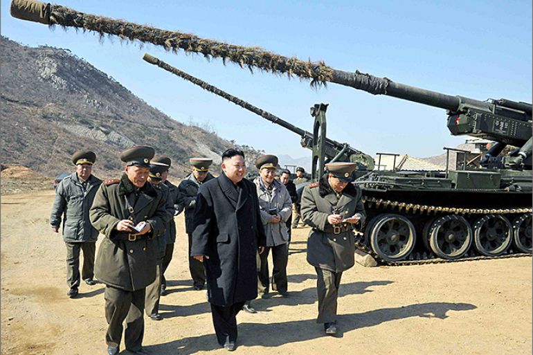 epa03619849 A picture released by the North Korean Central News Agency on 12 March 2013 shows North Korean leader Kim Jong Un inspecting a long-range artillery piece during an inspection of a unit of the Korean People's Army (KPA) in Pyongyang, North Korea, 11 March 2013. North Korea's official media earlier on 11 March had reported that Pyongyang considers the 1953 armistice no longer valid, which it said was in response to joint exercises by the US and South Korean militaries. EPA/KCNA