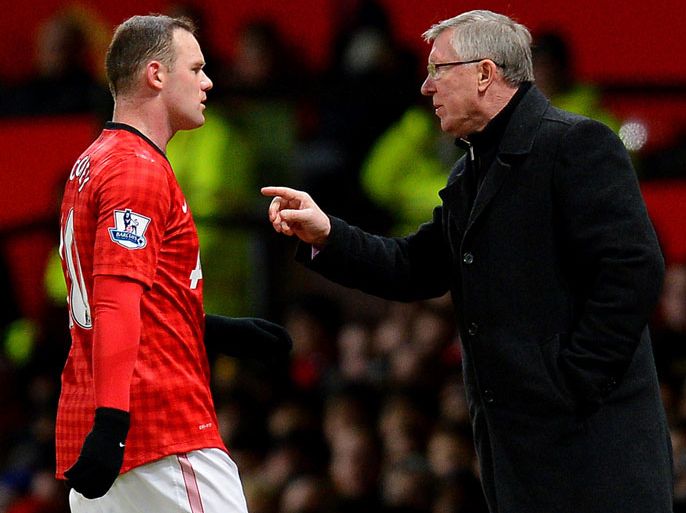 FILES) In a file picture taken on January 30, 2013 Manchester United's Scottish manager Alex Ferguson (R) talks to Manchester United's English forward Wayne Rooney during the English Premier League football match bewteen Manchester United and Southampton at Old Trafford in Manchester. Manchester United manager Alex Ferguson on March 8, 2013 dismissed suggestions Wayne Rooney could leave the club in the summer after being left out against Real Madrid in midweek. AFP PHOTO / ANDREW YATES
