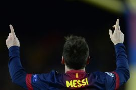 Barcelona's Argentinian forward Lionel Messi celebrates after scoring his second goal during the UEFA Champions League round of 16 second leg football match FC Barcelona against AC Milan at Camp Nou stadium in Barcelona on March 12, 2013. AFP PHOTO / JAVIER SORIANO