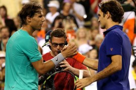 INDIAN WELLS, CA - MARCH 14: Rafael Nadal of Spain (L) shakes hands with Roger Federer of Switzerland after Nadal won their quarterfinal match during day 9 of the BNP Paribas Open at Indian Wells Tennis Garden on March 14, 2013 in Indian Wells, California. Nadal won 6-4, 6-2. Stephen Dunn/Getty Images/AFP== FOR NEWSPAPERS, INTERNET, TELCOS & TELEVISION USE ONLY ==
