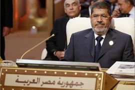 Egyptian President Mohamed Morsi attends the opening of the Arab League summit in the Qatari capital Doha on March 26, 2013. The Arab League kicked off a two-day summit in Doha where opponents of President Bashar al-Assad will represent Syria for the first time, despite rifts which have marred their political gains. AFP PHOTO/KARIM SAHIB