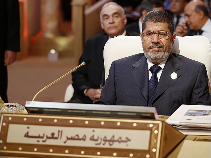 Egyptian President Mohamed Morsi attends the opening of the Arab League summit in the Qatari capital Doha on March 26, 2013. The Arab League kicked off a two-day summit in Doha where opponents of President Bashar al-Assad will represent Syria for the first time, despite rifts which have marred their political gains. AFP PHOTO/KARIM SAHIB