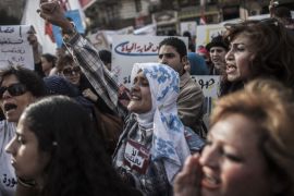 Egyptian women shout slogans during a protest marking the annual International Women's Day in Cairo, 08