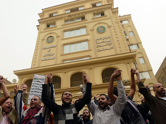 Members of the Egyptian Muslim brotherhood gather in front the party's headquarters in Cairo on March 22, 2013. A group of men stormed a Muslim Brotherhood office in the Egyptian capital, ransacking it and assaulting some of the group's members, the movement's spokesman told AFP. AFP PHOTO/KHALED DESOUKI