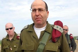 Israel's armed forces chief Moshe Yaalon walks after a visit to the Kissufim crossing in the Gaza strip in this February 16, 2005 file photo. Prime Minister Benjamin Netanyahu on March 17, 2013 chose Yaalon, an ex-general and vice premier from his right-wing Likud party, to be Israel's next defence minister, a government official said.