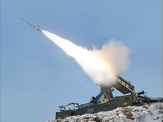 A rocket is fired during a drill of drone planes assaulting targets and a firing drill of self-propelled flak rocket destroying "enemy" cruise missiles coming in attack in low altitude, conducted by the air force and air defence artillery units of the Korean People's Army in an undisclosed location in this picture released by the North's official KCNA news agency in Pyongyang March 20, 2013. KCNA said this picture was taken on March 20, 2013. REUTERS/KCNA (NORTH KOREA - Tags: POLITICS MILITARY) ATTENTION EDITORS - THIS PICTURE WAS PROVIDED BY A THIRD PARTY. REUTERS IS UNABLE TO INDEPENDENTLY VERIFY THE AUTHENTICITY, CONTENT, LOCATION OR DATE OF THIS IMAGE. THIS PICTURE IS DISTRIBUTED EXACTLY AS RECEIVED BY REUTERS, AS A SERVICE TO CLIENTS. QUALITY FROM SOURCE. NO THIRD PARTY SALES. NOT FOR USE BY REUTERS THIRD PARTY DISTRIBUTORS