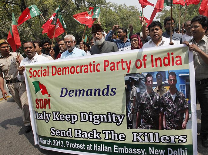 epa03623249 Indian members of social democratic party of India shout slogans as they protest near the Italian embassy in New Delhi, India on 14 March 2013 demanding from Italian government to send two Italian marines, charged in India with the murder of two fishermen. The marines were allowed to go to Italy by India's Supreme Court on March 22 for four weeks, to vote for the Italian general election but Italian government said the marines would not return to India to face trial. Italy risked undermining its ties with India unless Rome returns two marines charged in the killings of two fishermen near Kerala state last year, Indian Premier Manmohan Singh said. EPA/HARISH TYAGI