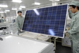 To go with China-US-solar-company-distress-Suntech,FOCUS by Bill Savadove This picture taken on February 27, 2012 shows workers assembling solar panels on the factory floor of Chinese company Suntech in the eastern Chinese city of Wuxi. China's Suntech has made a painful journey from being the world's largest solar panel producer to flirting with bankruptcy in just a year, highlighting the woes of the industry it shaped. AFP PHOTO / Peter PARKS