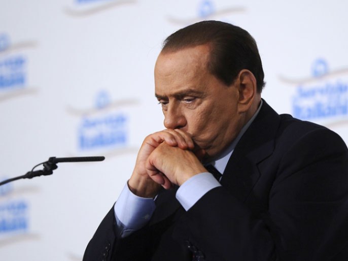 A file picture taken on February 28, 2011 in Milan shows Italy's former Prime Minister Silvio Berlusconi who has been sentenced to a year in prison on March 7, 2013, over the publication of leaked transcripts from a police wiretap in a newspaper that he owns. Berlusconi, who faces two more verdicts this month for tax fraud and having sex with an underage prostitute, can appeal the conviction which would suspend the sentence under Italian law
