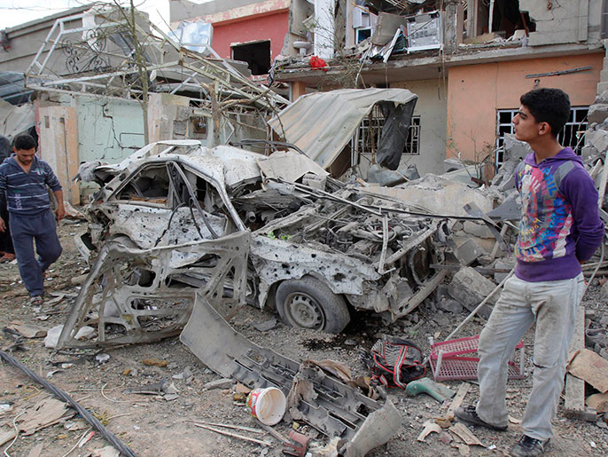 ‪آثار التفجير الذي وقع الجمعة في كركوك‬ آثار التفجير الذي وقع الجمعة في كركوك (رويترز)