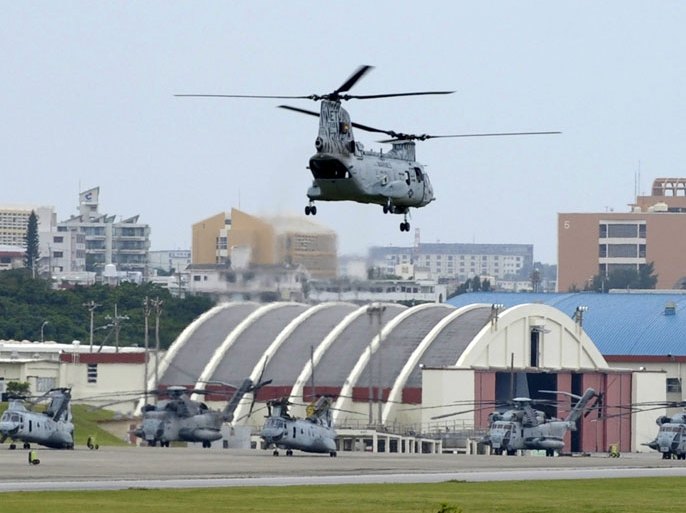 KIT112 - Ginowan, Okinawa, JAPAN : (FILES) This file photo taken on April 26, 2010 shows a US Marines' CH-46E helicopter taking off from the US Marine Corps Air Station Futenma in Ginowan, Okinawa prefecture. The North Korean army on March 21, 2013 threatened a possible strike against US military bases in Japan, in response to the use of nuclear-armed US B-52 bombers in joint military drills with South Korea. AFP PHOTO / FILES / TOSHIFUMI KITAMURA