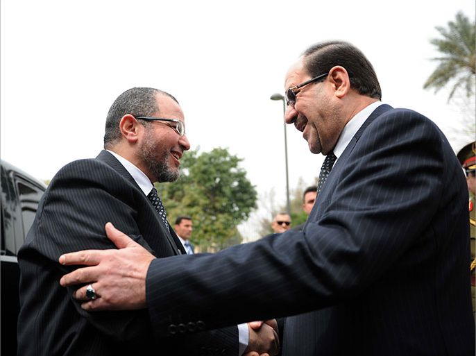 Iraqi Prime Minister Nuri al-Maliki (R) welcomes his Egyptian counterpart Hisham Qandil upon his arrival for an official visit on March 4, 2013 in the Iraqi capital Baghdad. AFP PHOTO/HO/PRIME MINISTER'S OFFICE == RESTRICTED TO EDITORIAL USE - MANDATORY CREDIT "AFP PHOTO / HO/ PRIME MINISTER'S OFFICE" - NO MARKETING - NO ADVERTISING CAMPAIGNS - DISTRIBUTED AS A SERVICE TO CLIENTS ==