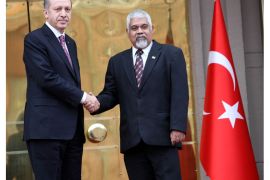 Turkish Prime Minister Tayyip Erdogan, (L) shake hands with with Suriname's Vice-President Robert Ameerali during a ceremony in Ankara, on March 7, 2013