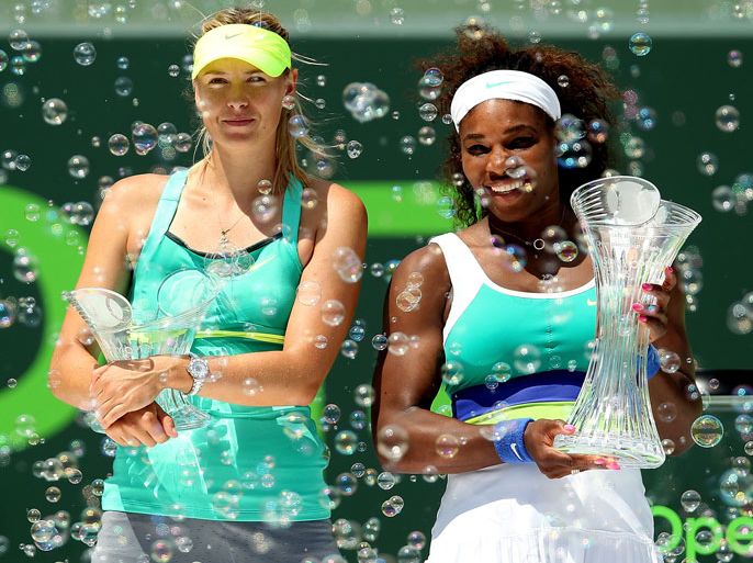 KEY BISCAYNE, FL - MARCH 30: Maria Sharapova of Russia and Serena Williams pose for photographers after the final of the Sony Open at Crandon Park Tennis Center on March 30, 2013 in Key Biscayne, Florida. Matthew Stockman/Getty Images/AFP== FOR NEWSPAPERS, INTERNET, TELCOS & TELEVISION USE ONLY ==