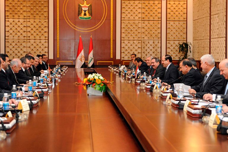 Iraq's Prime Minister Nuri al-Maliki meets with Egypt's Prime Minister Hisham Qandil and his delegation in Baghdad, in this March 4, 2013 picture provided by Iraqi Prime Minister Media Office. REUTERS/Iraqi Prime Minister Media Office/Handout (IRAQ - Tags: POLITICS) ATTENTION EDITORS - THIS IMAGE WAS PROVIDED BY A THIRD PARTY. FOR EDITORIAL USE ONLY. NOT FOR SALE FOR MARKETING OR ADVERTISING CAMPAIGNS. THIS PICTURE IS DISTRIBUTED EXACTLY AS RECEIVED BY REUTERS, AS A SERVICE TO CLIENTS