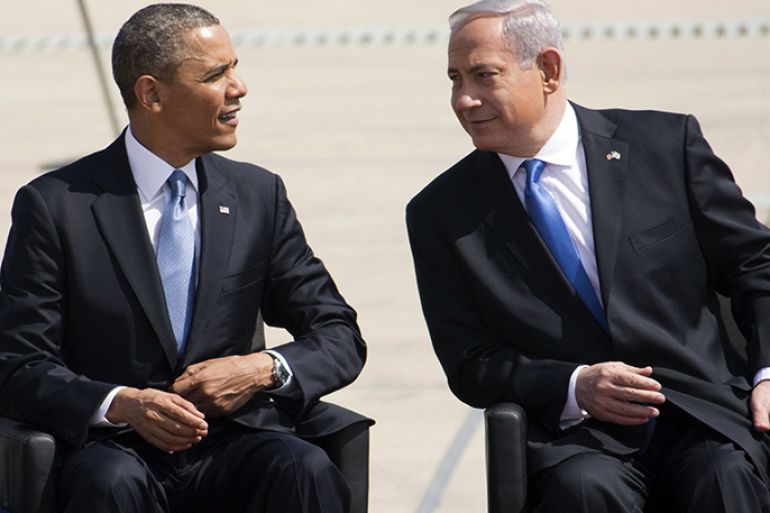 US President Barack Obama sits next to Israeli Prime Minister Benjamin Netanyahu during a welcome ceremony at Israel’s International Ben Gurion airport on March 20, 2013. Obama landed in Israel for the first time as US president, on a mission to ease past tensions with his hosts and hoping to paper over differences on handling Iran's nuclear threat. AFP PHOTO/JACK GUEZ