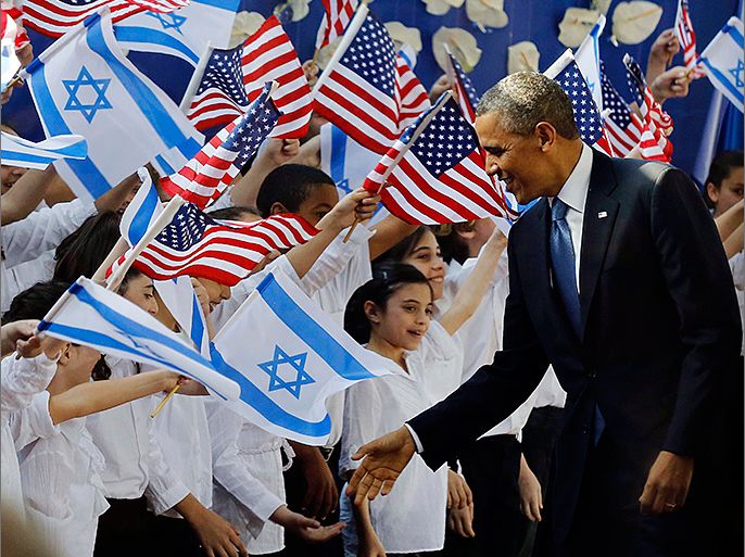 U.S. President Barack Obama shakes hands with children before he signs a guest book at the residence of Israel's President Shimon Peres in Jerusalem, March 20, 2013. REUTERS/Larry Downing (ISRAEL - Tags: POLITICS)