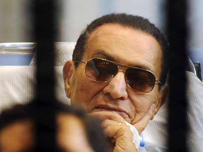 Former Egyptian President Hosni Mubarak sits inside a cage in a courtroom at the police academy in Cairo April 13, 2013. The retrial of former Egyptian President Hosni Mubarak was aborted on Saturday when the presiding judge withdrew from the case and referred it to another court, causing an indefinite delay that sparked anger in the courtroom. REUTERS/Stringer (EGYPT - Tags: POLITICS CRIME LAW)