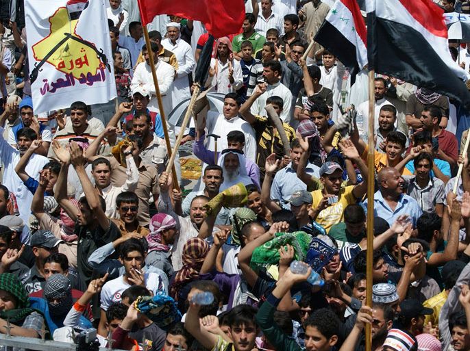 Iraqi Sunni Muslims take part in an anti-government demonstration in Fallujah, 50 km (31 miles) west of Baghdad April 19, 2013. Thousands of Sunni Muslims protested after Friday prayers in huge rallies against Shi'ite Iraqi Prime Minister Nuri al-Maliki, demanding that he step down. REUTERS