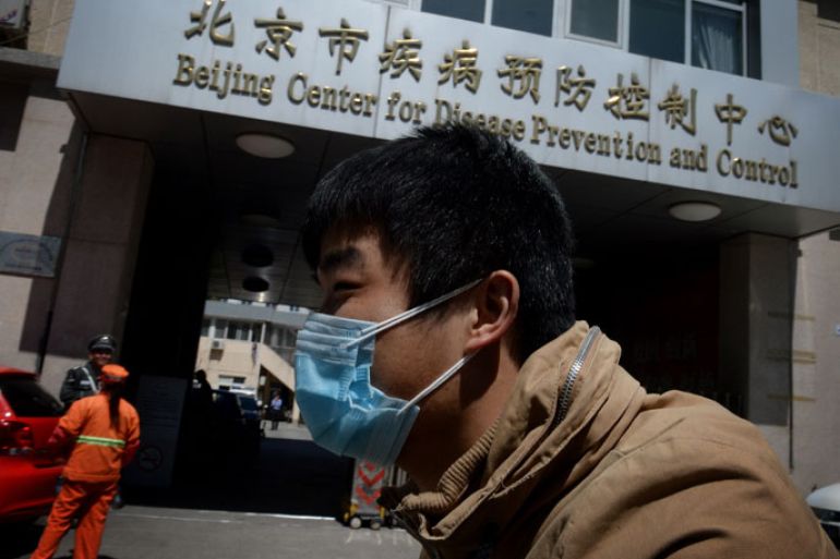 A Chinese man arrives at the Beijing Center for Disease Prevention and Control as the country deals with the H7N9 bird flu virus on April 18, 2013. China has confirmed a total of 82 human cases of H7N9 avian influenza since announcing about two weeks ago that it had found the strain in people for the first time. Health authorities in China say they do not know exactly how the virus is spreading, but it is believed to be crossing to humans from birds, triggering mass poultry culls in several cities. AFP PHOTO/Mark RALSTON