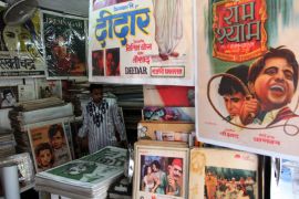 epa03605831 An Indian vendor sells old bollywood posters at the Chor Bazaar (Thieves Market), in Mumbai, India, 01 March 2013. Chor Bazaar is one of the largest flea markets in India, flanked by the rows of little antique shops and sell anything from old ship parts, old bollywood posters, authentic Victorian furniture, replacement parts for automobiles, old clocks, gramophones, to crystal chandeliers, at a very cheap price, although bargains are sometimes staggering