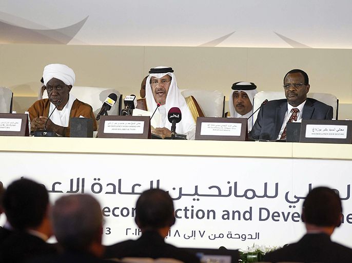 Qatari Prime Minister and Foreign Minister Sheik Hamad bin Jassim al-Thani (C) speaks during the International Donors Conference for Reconstruction and Development in Darfur, in Doha on April 7, 2013. Representatives of donor countries and aid groups began meeting to endorse a strategy to rebuild Sudan's Darfur region, where a decade-long conflict shocked the world with atrocities against civilians. AFP PHOTO/STR