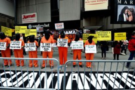 Activists demand the closing of the US military's detention facility in Guantanamo during a protest, part of the Nationwide for Guantanamo Day of Action, April 11, 2013 in New York's Times Square. The Guantanamo jail, in a US Navy base in Cuba, was opened in 2002 to hold prisoners taken in the "War on Terror" waged by then US President George W. Bush after the 9/11 attacks